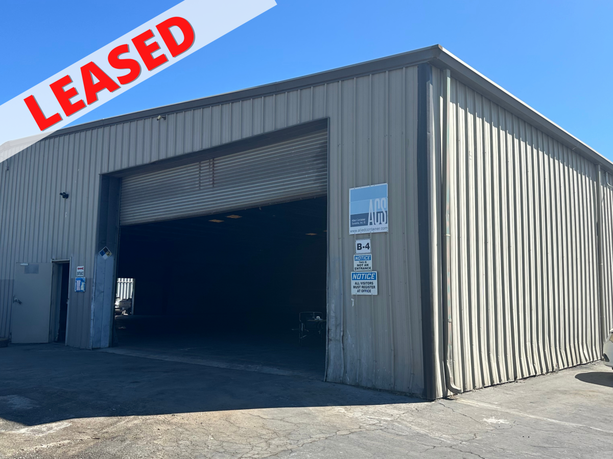 external picture of the warehouse space at 511 Wilbur Ave with a banner reading "Leased" across it